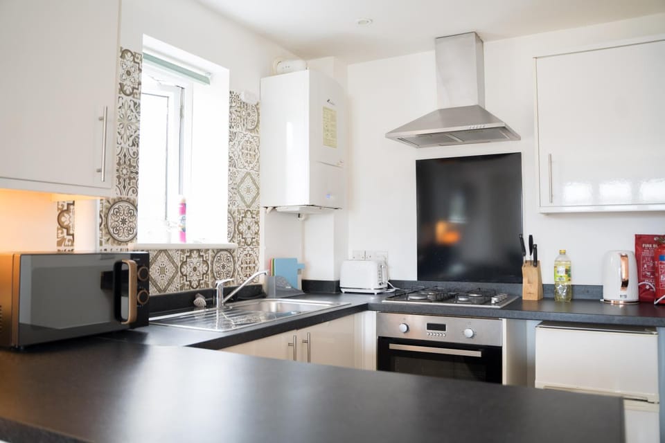 microwave, minibar, oven, stove, kitchen
