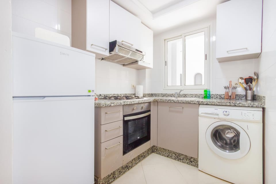 Kitchen or kitchenette, oven, stove, washing machine