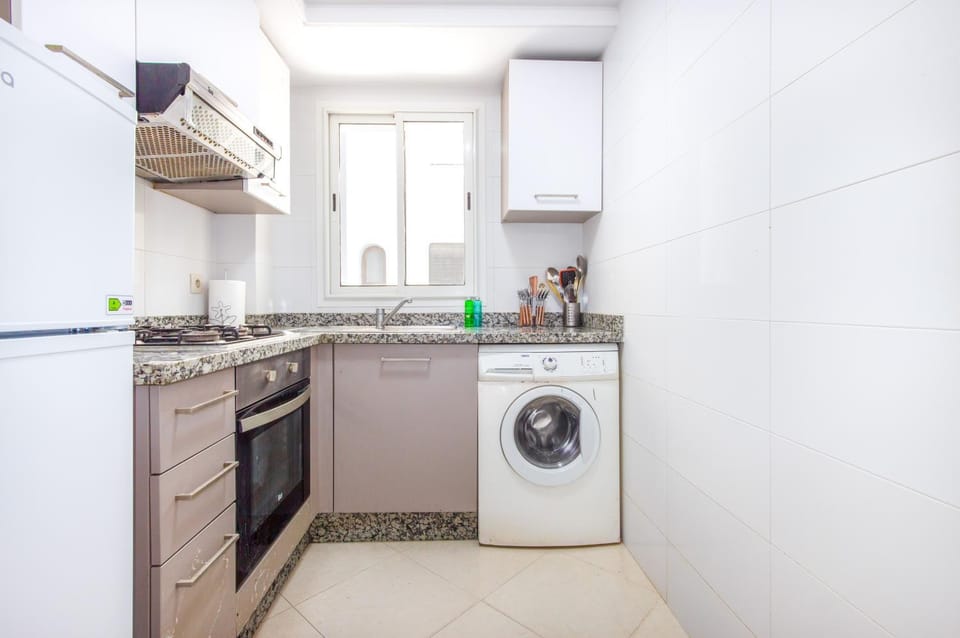 Kitchen or kitchenette, oven, stove, washing machine