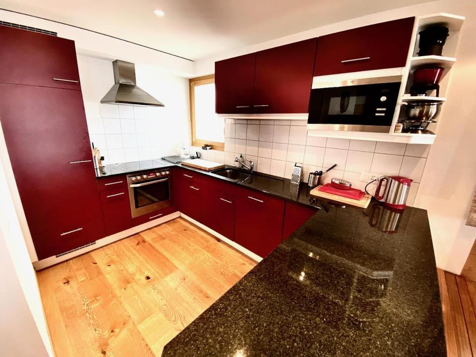 Kitchen or kitchenette, dishwasher, oven, stove