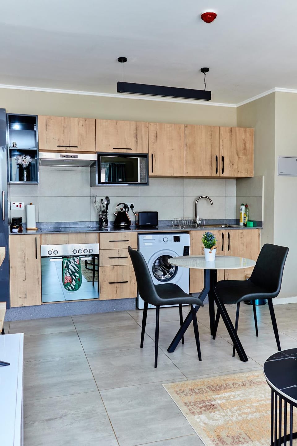Kitchen or kitchenette, Dining area, oven, stove, washing machine