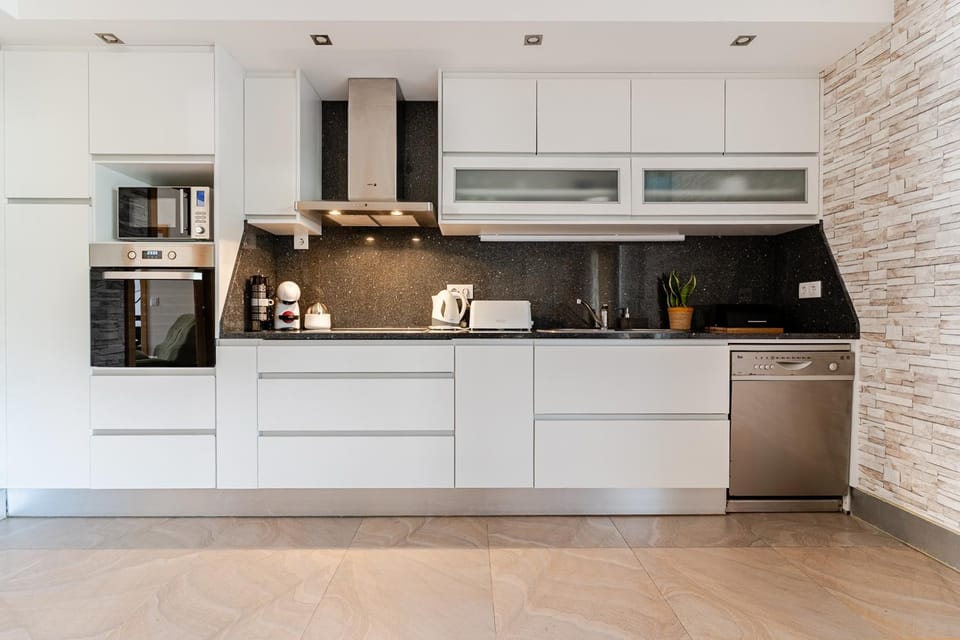 Kitchen or kitchenette, dishwasher, microwave, oven, toaster, kitchen