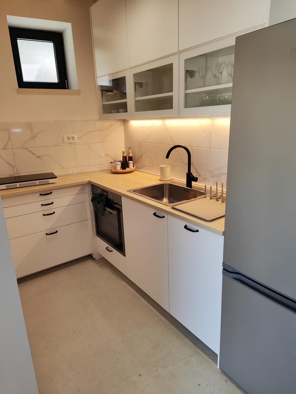 Kitchen or kitchenette, dishwasher, oven, stove