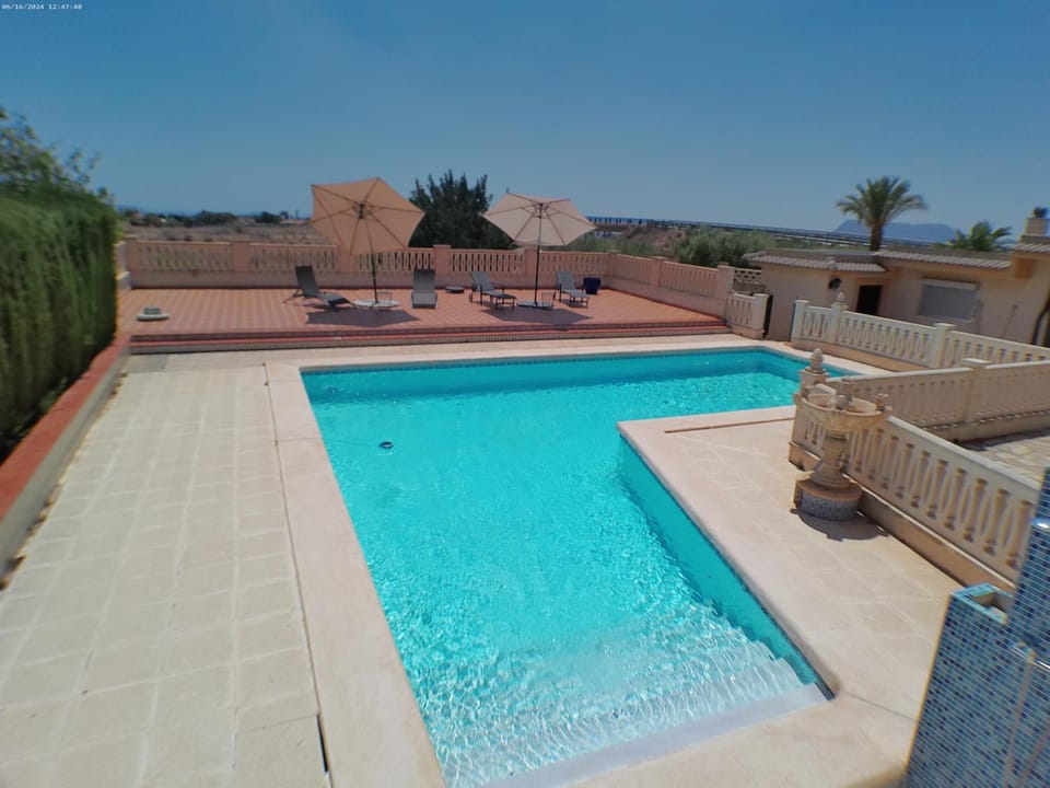 Patio, Day, Natural landscape, Pool view, Swimming pool, sunbed