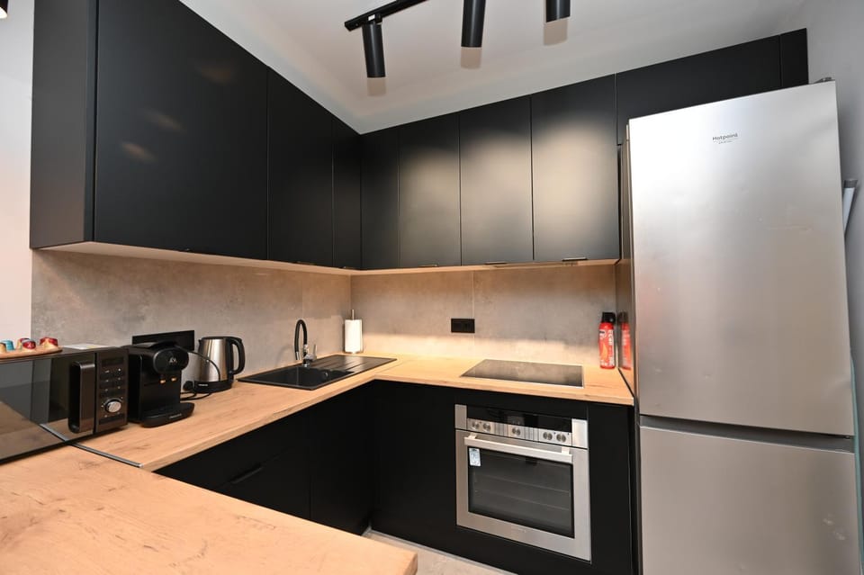 Kitchen or kitchenette, dishwasher, oven, stove, toaster