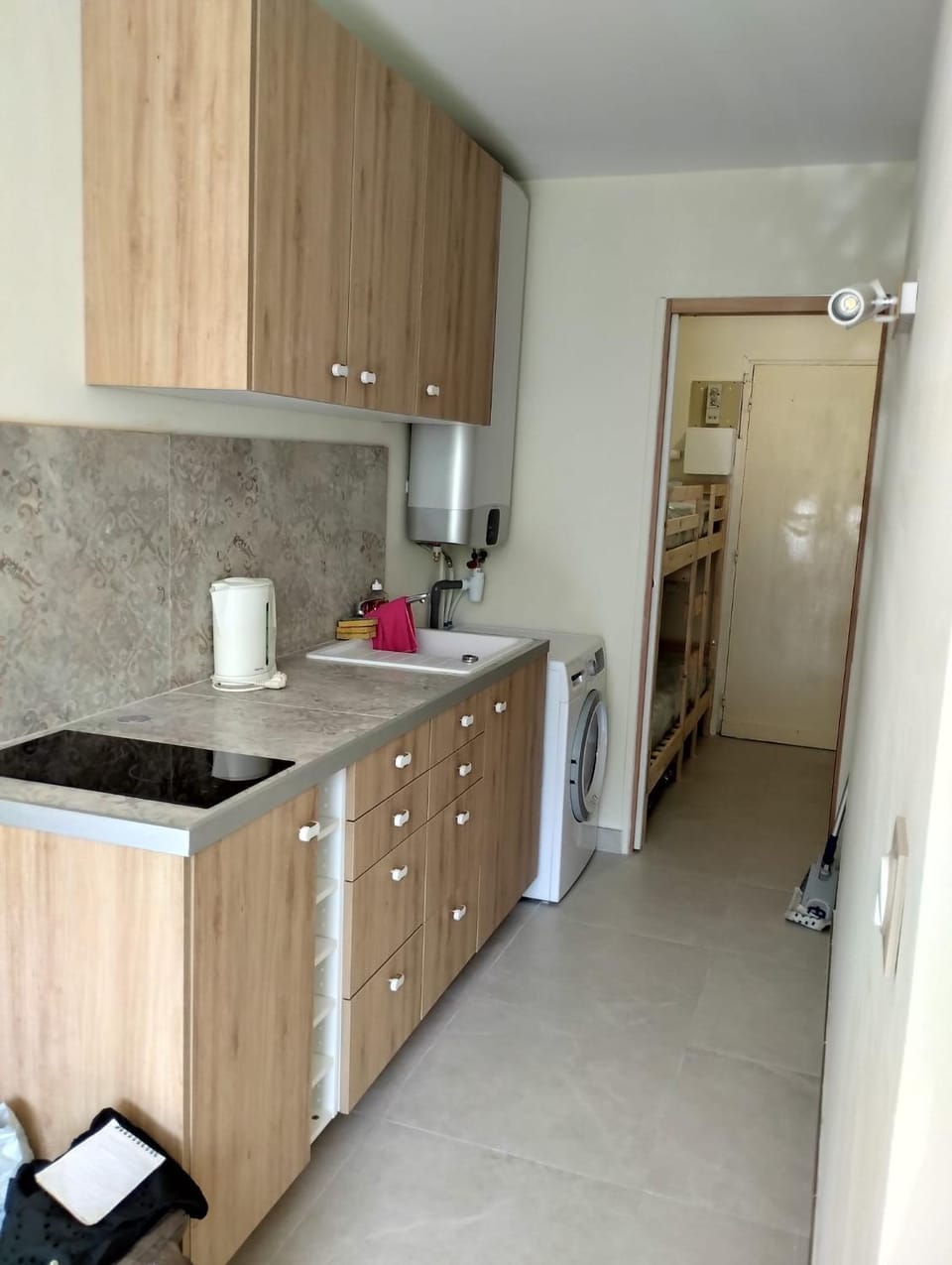Kitchen or kitchenette, oven, stove, washing machine