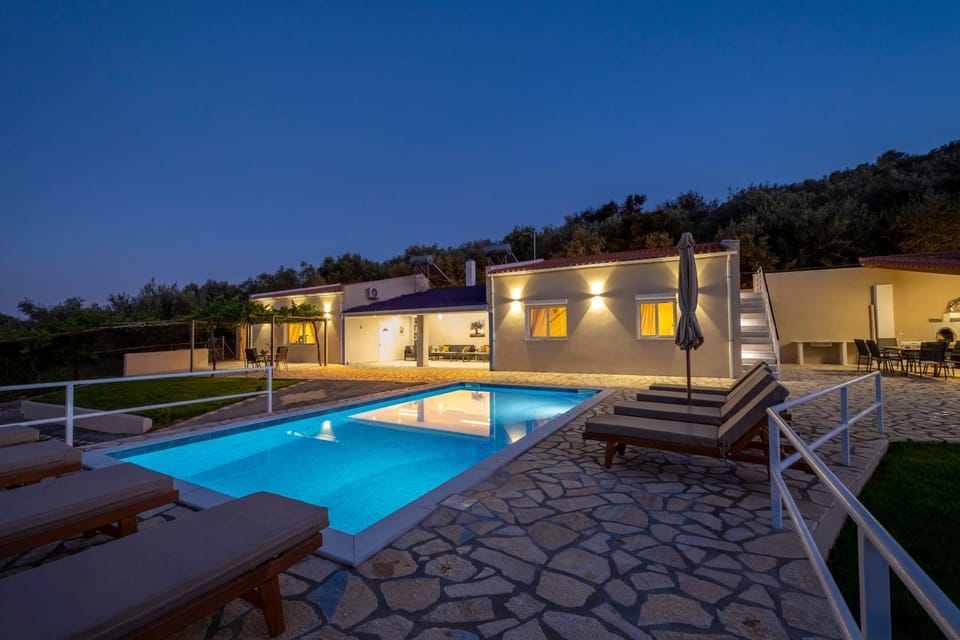 Property building, Patio, Night, Pool view, Swimming pool, sunbed