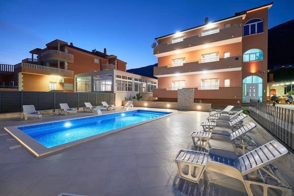 Property building, Patio, Night, Pool view, Swimming pool, sunbed