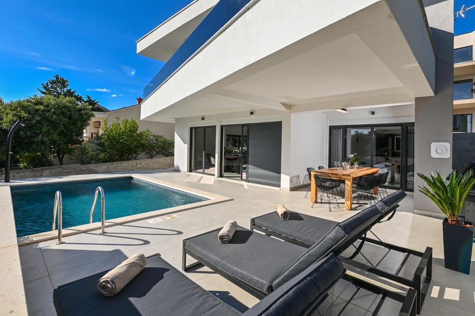 Patio, Seating area, Swimming pool, sunbed