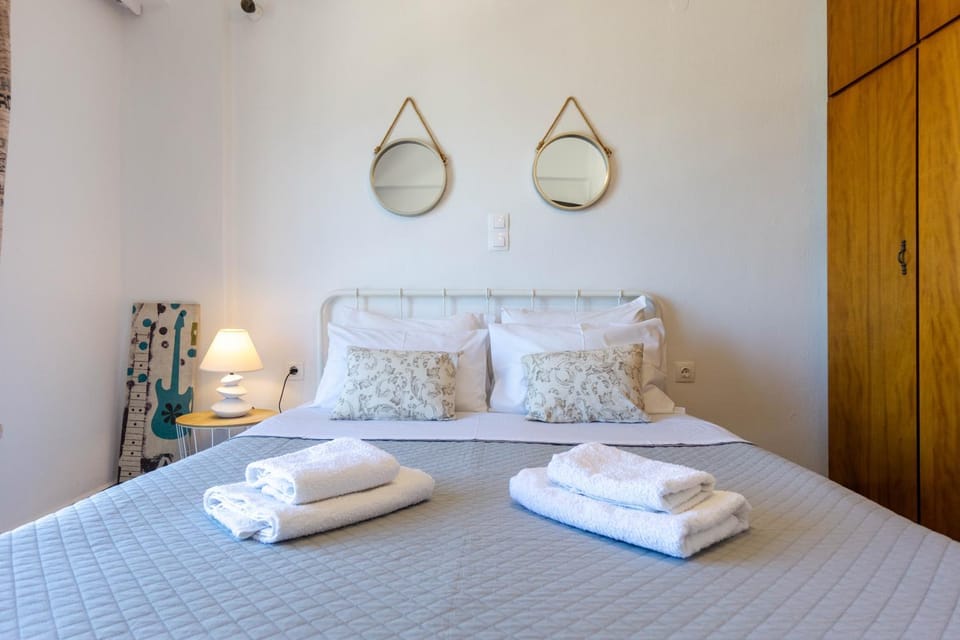 Bed, towels, wardrobe