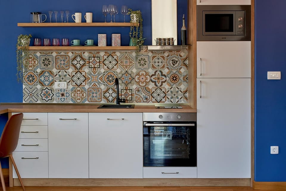 Kitchen or kitchenette, dishwasher, oven, stove