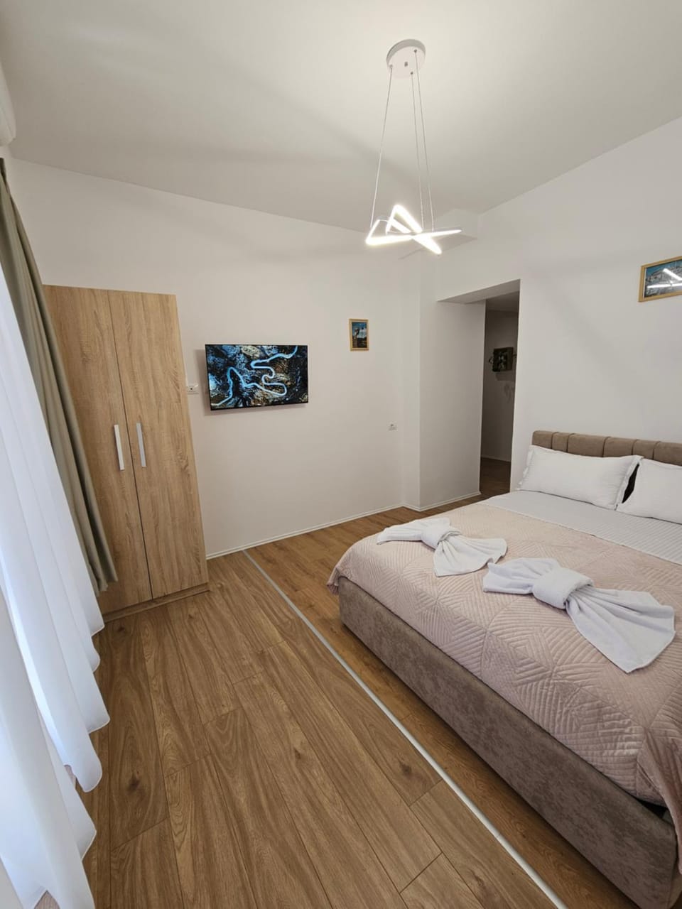 Bed, towels, wardrobe