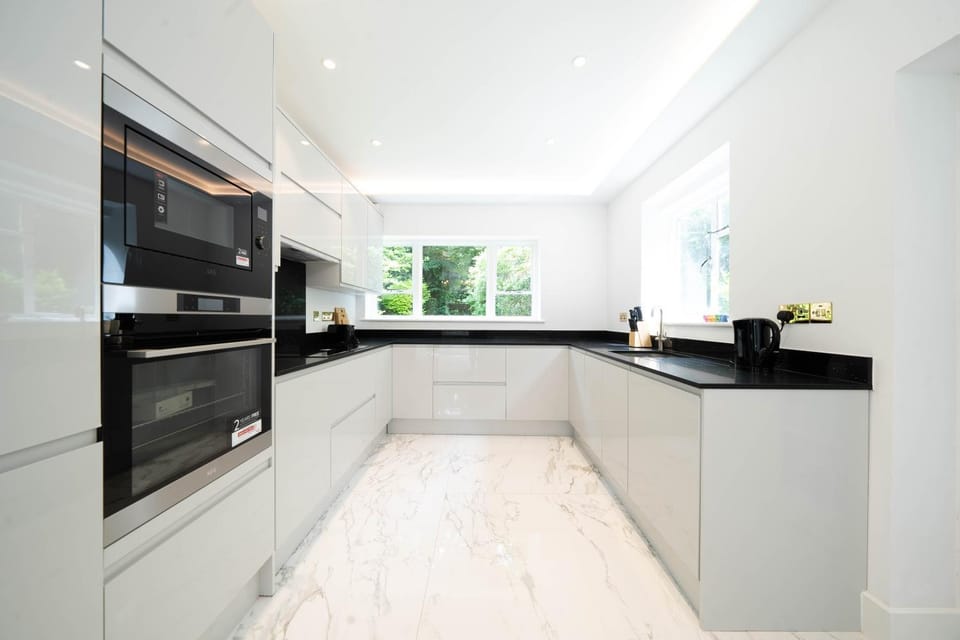 Kitchen or kitchenette, dishwasher, oven, stove