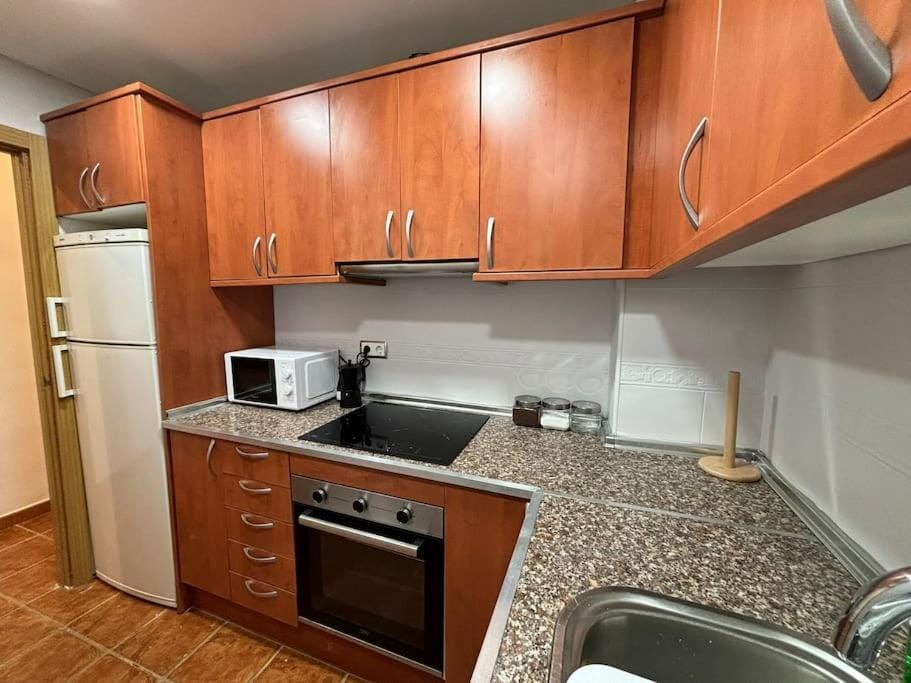 Kitchen or kitchenette, oven, stove