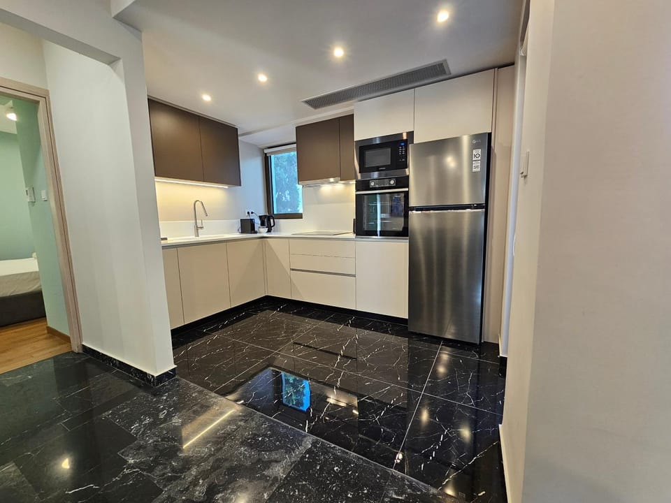 Kitchen or kitchenette, dishwasher, oven, stove