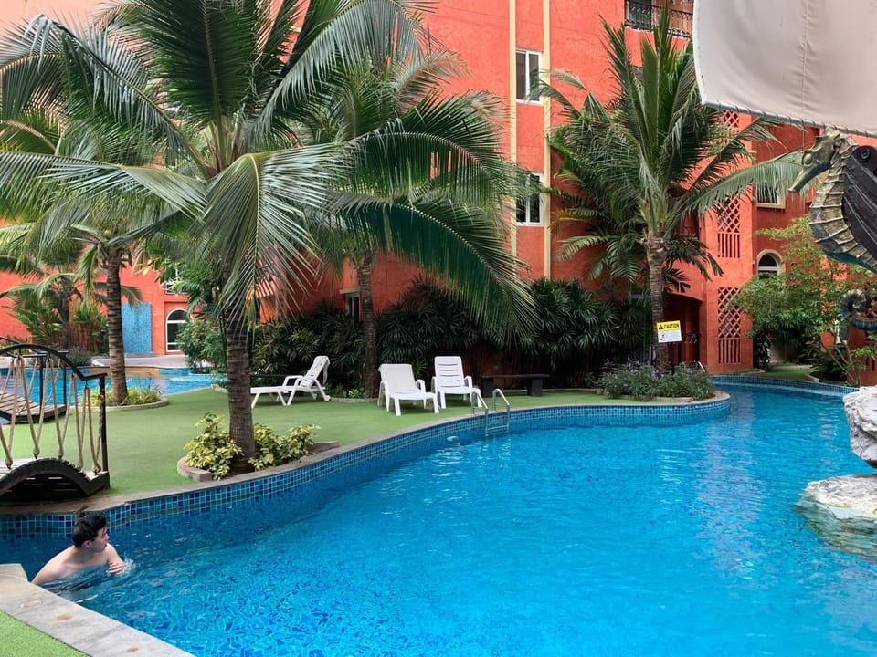 Property building, Day, Pool view, Swimming pool, sunbed
