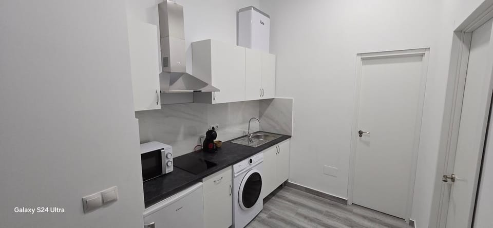 Kitchen or kitchenette, stove, washing machine