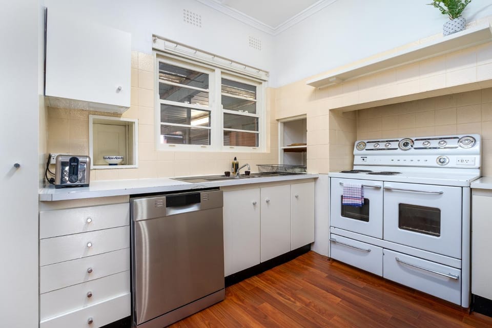 Kitchen or kitchenette, dishwasher, oven, stove, toaster