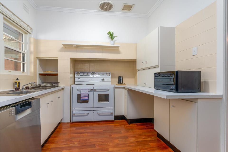 Kitchen or kitchenette, dishwasher, stove, washing machine, dryer