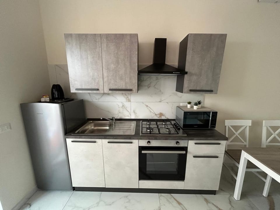 Kitchen or kitchenette, oven, stove