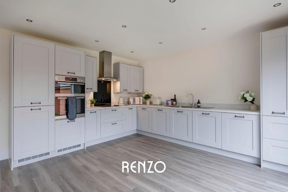 Kitchen or kitchenette, dishwasher, oven, stove