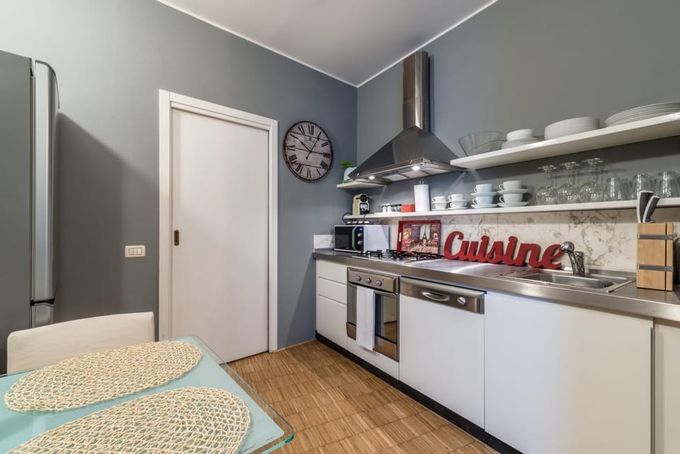 Kitchen or kitchenette, dishwasher, oven, stove