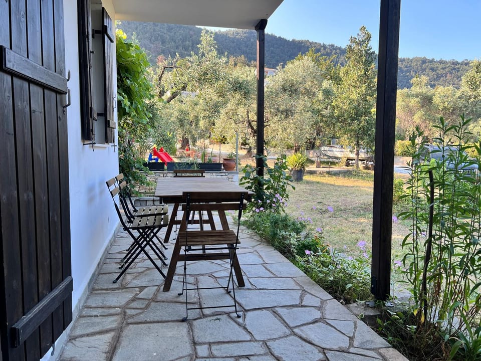 Property building, Patio, Natural landscape, Dining area, Garden view, Mountain view