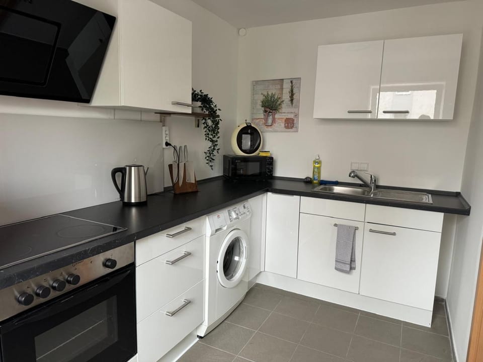 Kitchen or kitchenette, oven, stove, washing machine