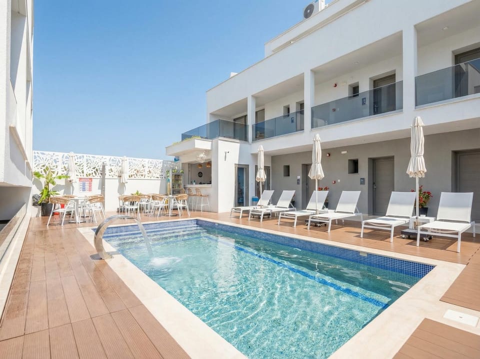 Property building, Day, View (from property/room), Pool view, Swimming pool, sunbed