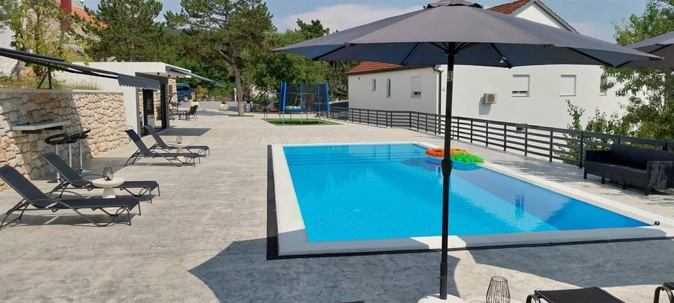 Patio, Day, Pool view, Swimming pool, sunbed