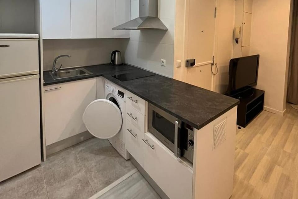Kitchen or kitchenette, oven, stove, washing machine, dryer