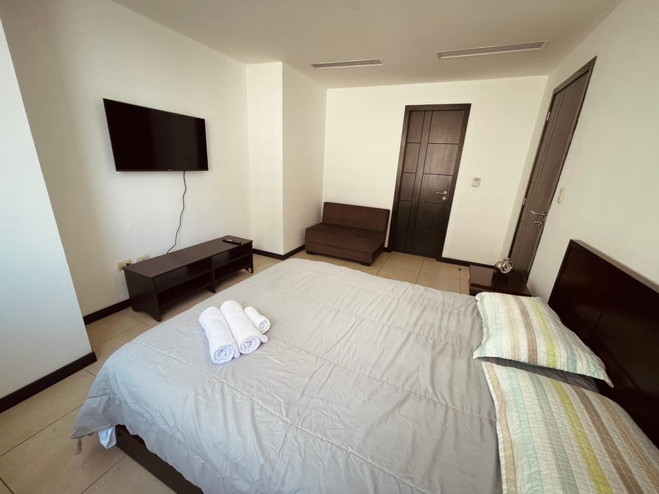 Photo of the whole room, Bedroom, towels, air conditioner