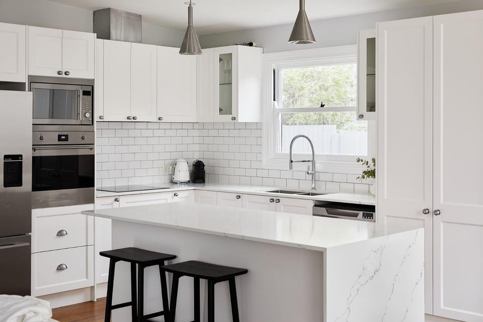 Kitchen or kitchenette, dishwasher, oven, stove
