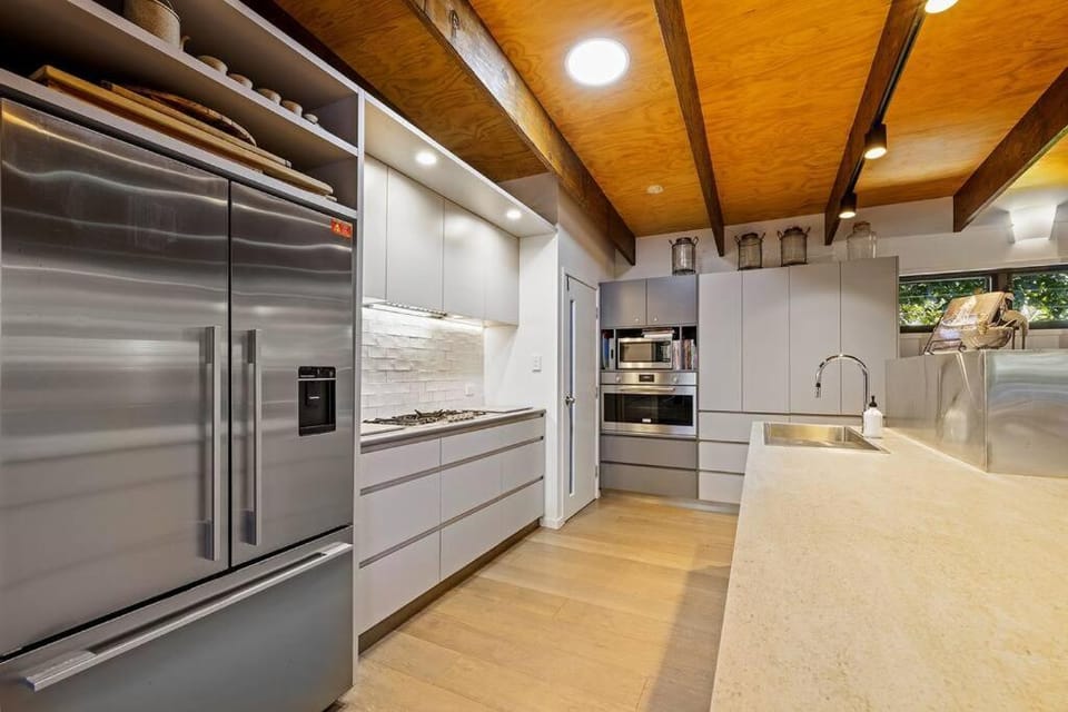 Kitchen or kitchenette, dishwasher, oven, stove
