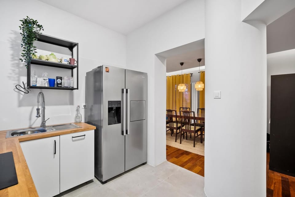 Kitchen or kitchenette, dishwasher, oven, stove