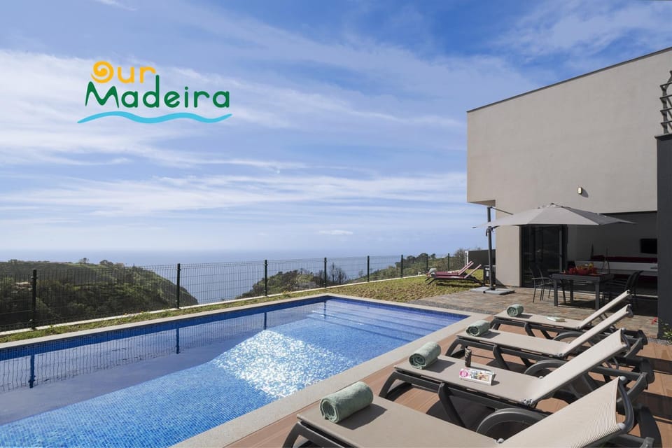 Property building, Patio, Day, Natural landscape, View (from property/room), Balcony/Terrace, Other, Evening entertainment, Text overlay, Pool view, Sea view, Swimming pool, sunbed