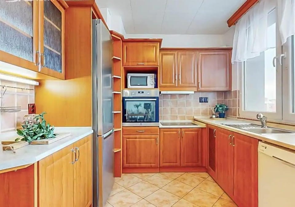Kitchen or kitchenette, dishwasher, oven, stove