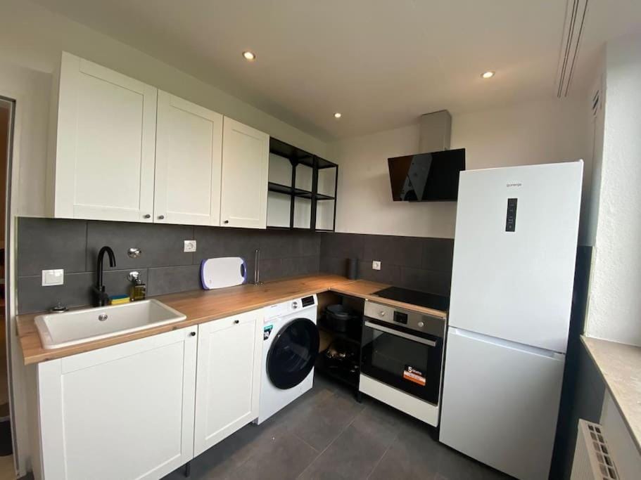 Kitchen or kitchenette, dishwasher, oven, stove, toaster