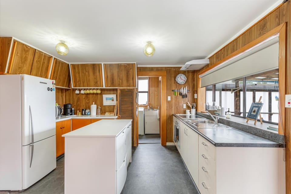 Kitchen or kitchenette, dishwasher, oven, stove