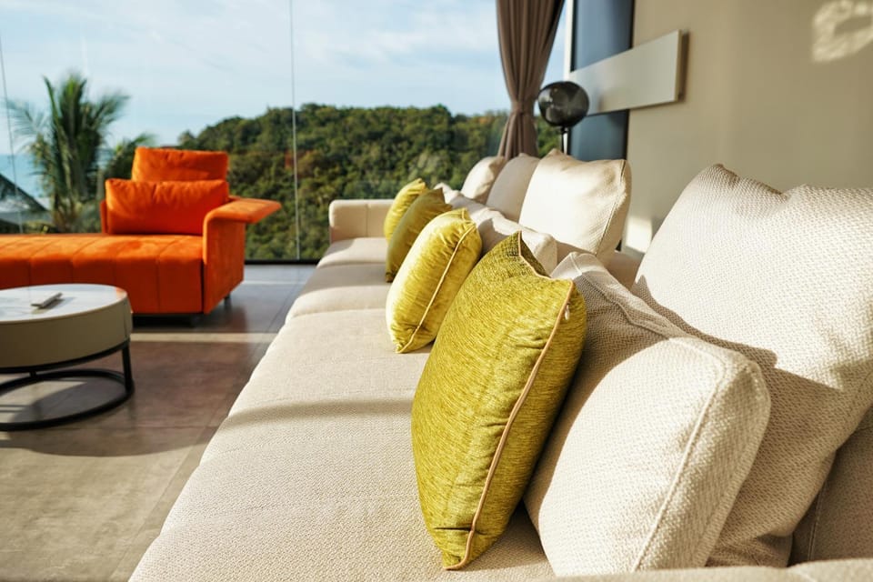 Property building, Living room, Seating area, Evening entertainment, Sea view, Sunrise, Sunset