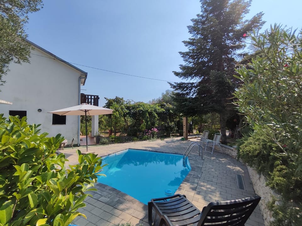 Property building, Patio, Day, Pool view, Swimming pool