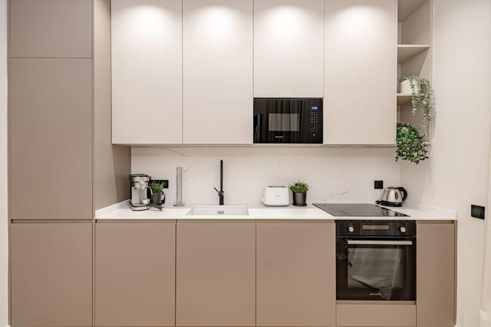 Kitchen or kitchenette, dishwasher, oven, stove, toaster
