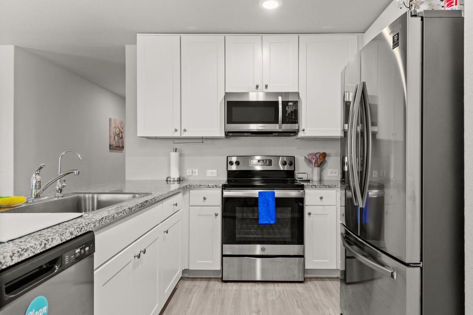 Kitchen or kitchenette, dishwasher, oven, stove