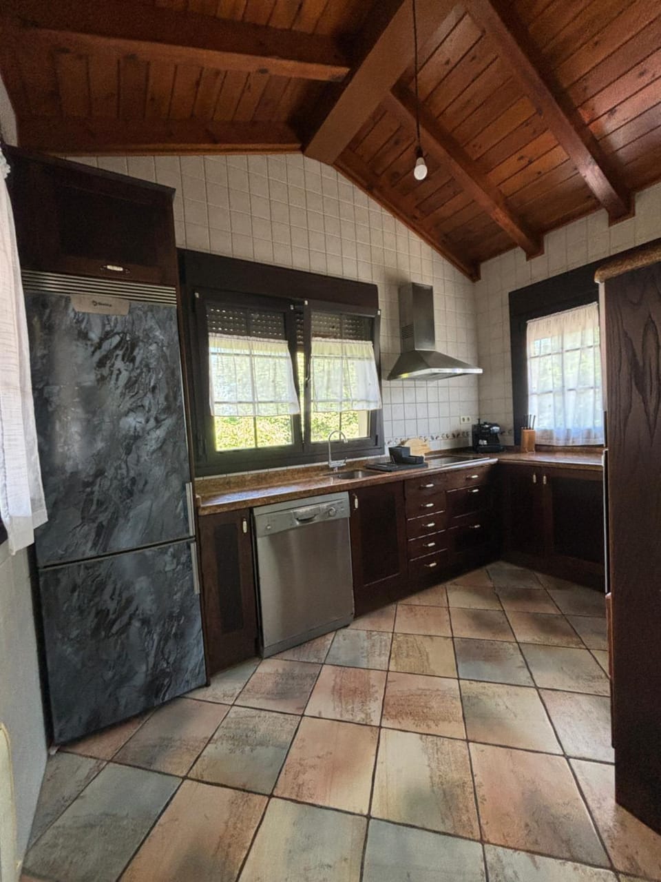 Kitchen or kitchenette, dishwasher, oven, stove