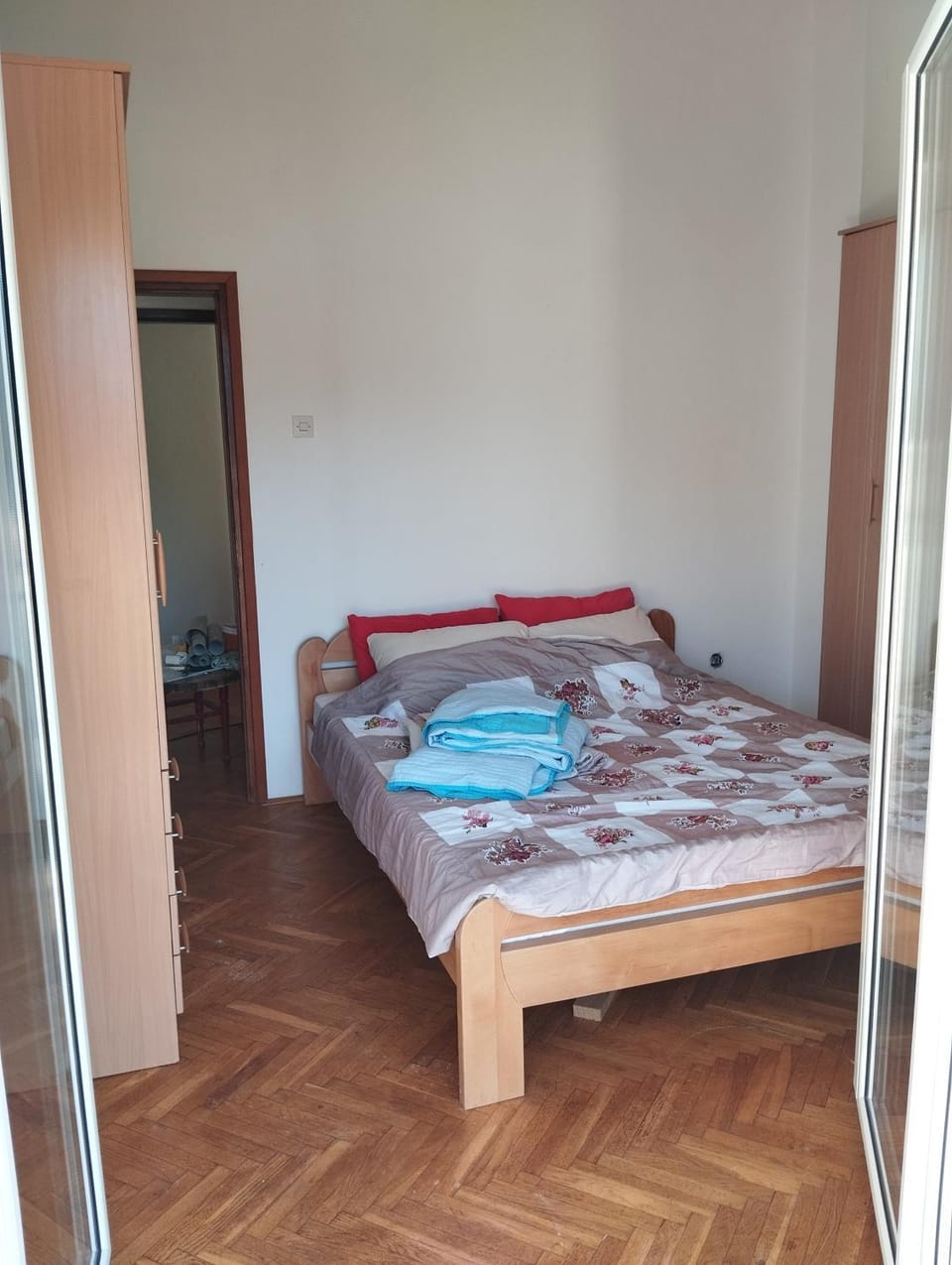 Bed, towels, wardrobe