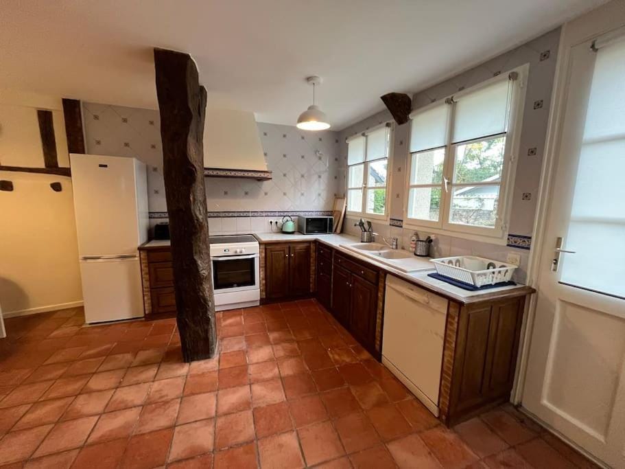 Kitchen or kitchenette, dishwasher, oven, stove