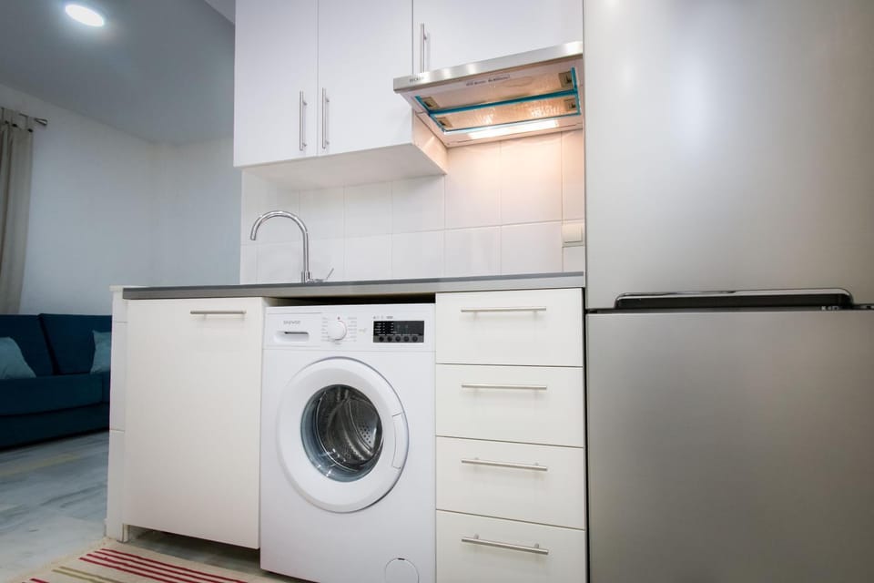 Kitchen or kitchenette, washing machine