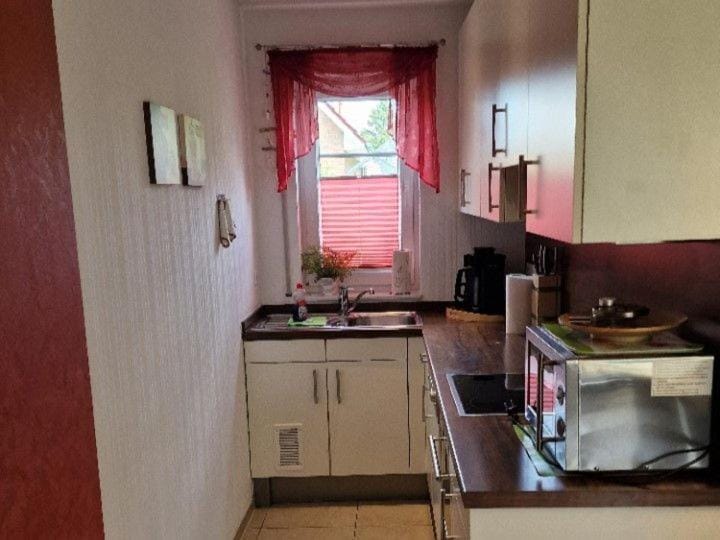 Kitchen or kitchenette, dishwasher, oven, stove