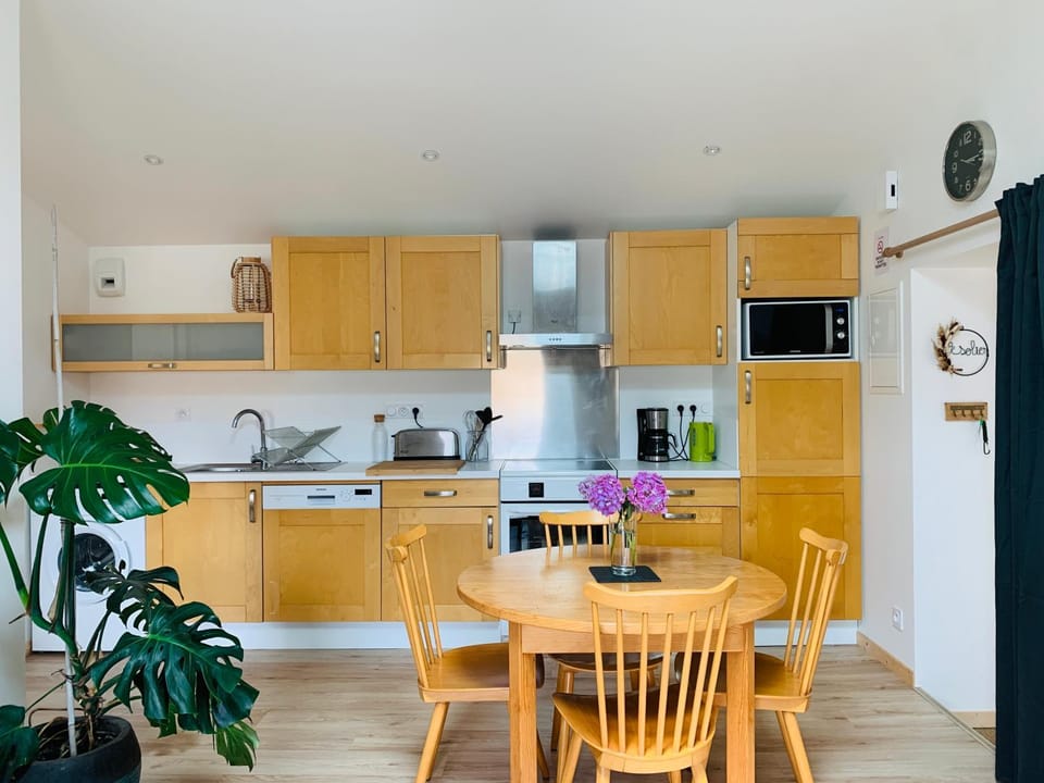 Kitchen or kitchenette, dishwasher, microwave, stove, washing machine