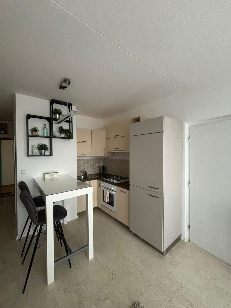 Kitchen or kitchenette, dishwasher, oven, stove